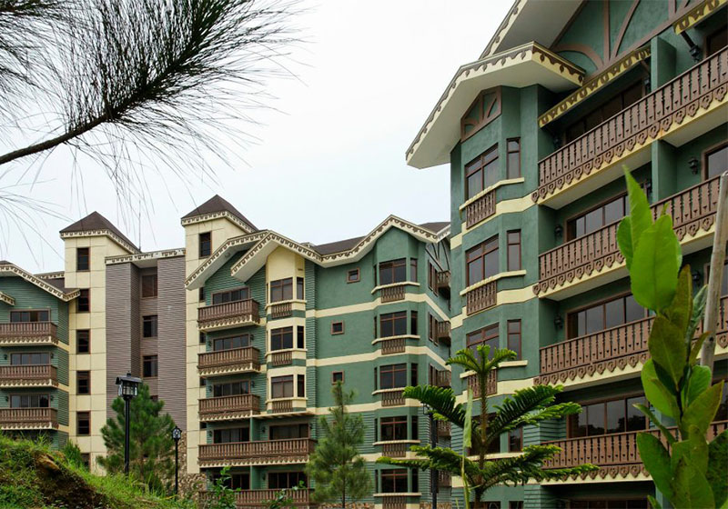 Balcony view of pine trees at Crosswinds